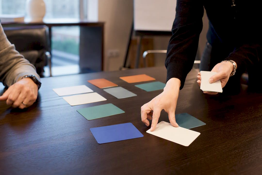 Hands exchanging training role-play cards
