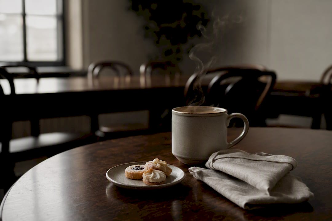 Coffee cup with steam on workshop side table