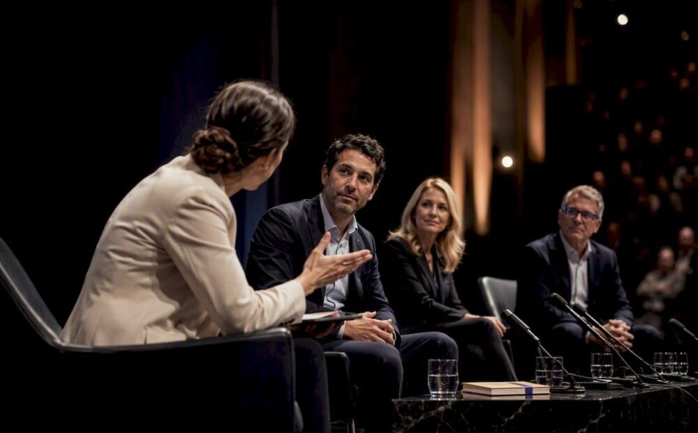 Moderator guiding a live panel discussion