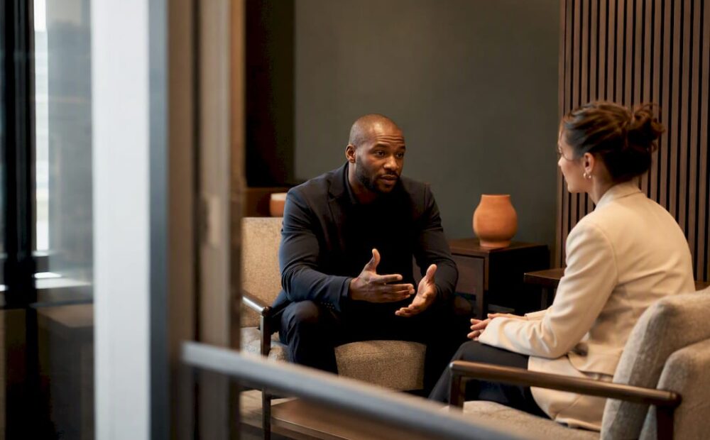 Colleagues having a calm accountability conversation