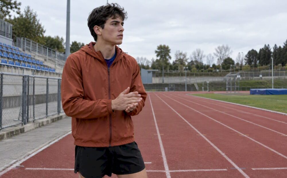 Runner pausing nervously before a race