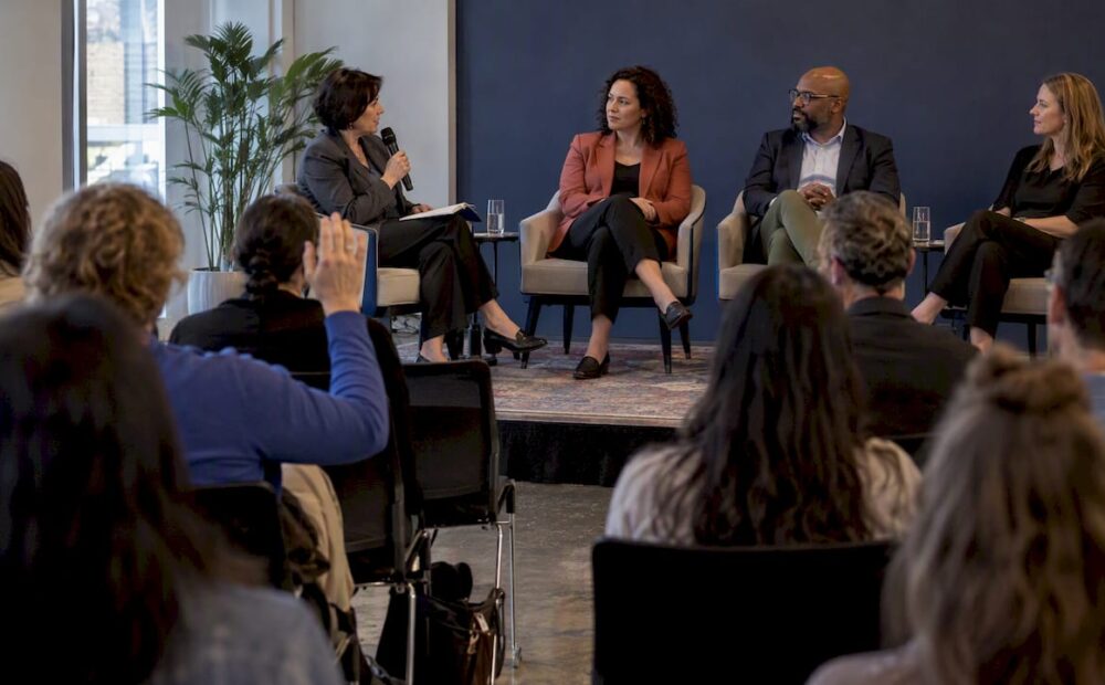 Moderator leading a panel of experts