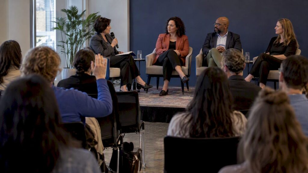 Moderator leading a panel of experts